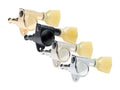 Four tuning machine heads in gold, black, nickel, and chrome finishes with cream tuning keys.