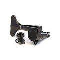 Black bass guitar tuning key with mounting bushing and screw on a white background.