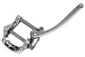 Silver metal vibrato tailpiece with a lever arm and 'Bigsby' logo on the base plate.