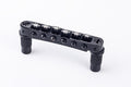 Black metal roller Tune-o-matic bridge with six adjustable rollers and two mounting posts.