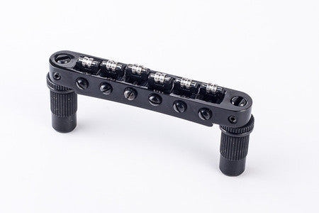 Black metal roller Tune-o-matic bridge with six adjustable rollers and two mounting posts.
