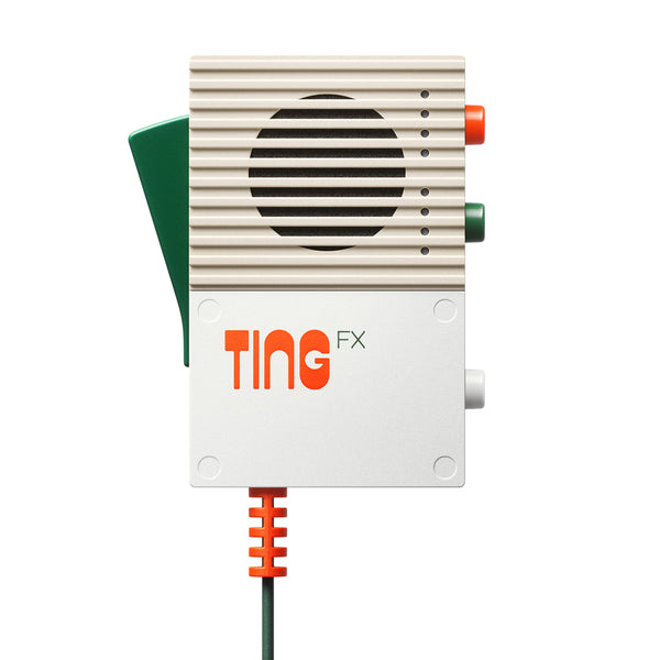 White and beige device with speaker grille, labeled TING FX, with colored buttons and wired cable.