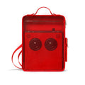 Red rectangular carrying case with mesh front panel and two circular speaker-like shapes inside, shown from the front.