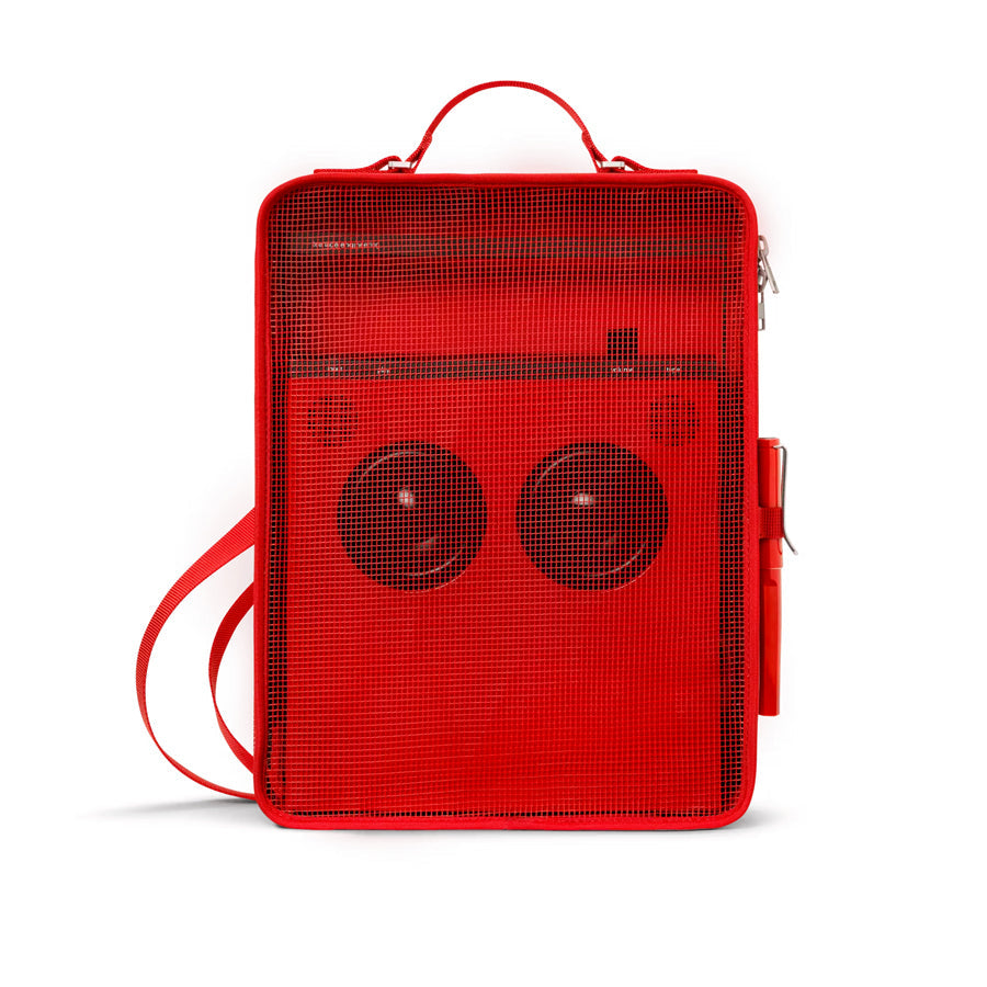 Red rectangular carrying case with mesh front panel and two circular speaker-like shapes inside, shown from the front.