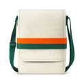 Cream fabric shoulder bag with a front flap and a wide orange and green horizontal band, plus an adjustable green strap.