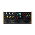 Front view of a black Pittsburgh Modular Taiga Desktop synthesizer with multiple knobs, sliders, and patch jacks.