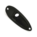 Black metal plate with two outer mounting holes and a central oval-shaped cutout, viewed at an angle.