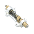 Metal spring assembly mounted on a silver metal base plate with gold threaded adjustments.