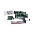 Four printed circuit boards, two ribbon cables, and a small bag with screws and a sensor are arranged on a white background.