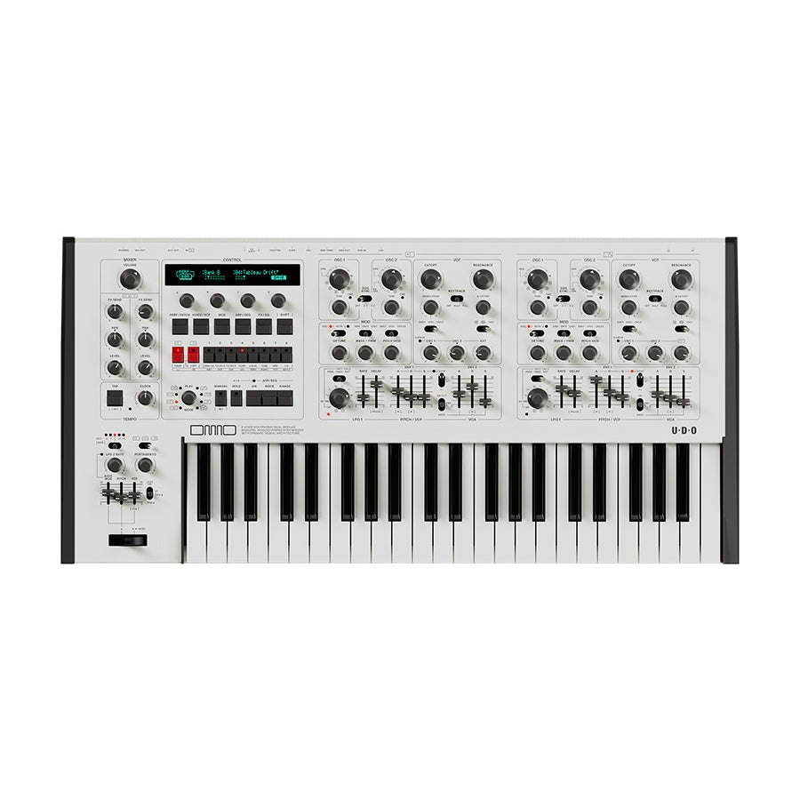 White keyboard synthesizer with multiple knobs, faders, buttons, and a small blue screen.