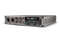 Front angle view of a Silver and black audio interface unit with RJ45, BNC, USB-C ports and a digital display.