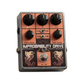 Metal guitar effect pedal with multiple knobs, switches, and artwork labeled Improbability Drive.