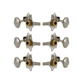 Set of six nickel and gold guitar machine heads arranged in two columns of three.