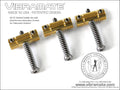 Three brass guitar saddles each with a silver dual-access intonation screw and black adjustment screw.
