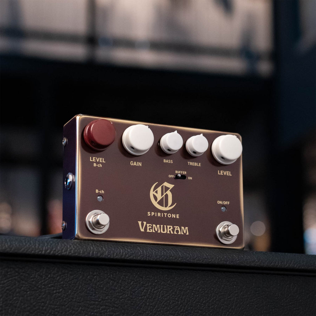 Vemuram Spiritone guitar effects pedal with multiple knobs, toggle switch, and two footswitches on a brown panel.