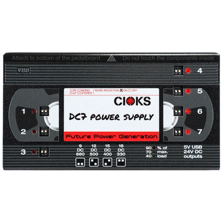 Black rectangular power supply unit with numbered power outputs and label reading CIOKS DC7 Power Supply
