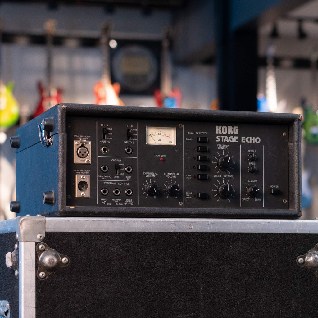 Front view of a vintage Korg Stage Echo audio effects unit with knobs, switches, and multiple input/output jacks.