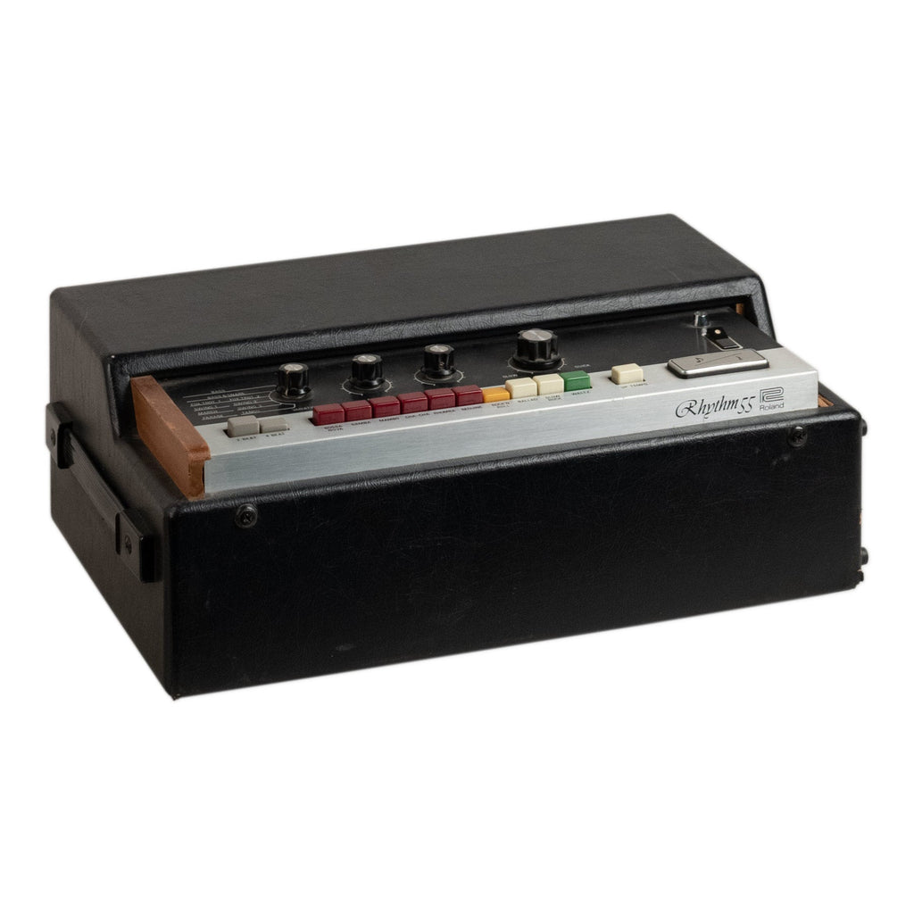 Black vintage electronic musical instrument with silver control panel and multiple colored buttons and knobs in a case.