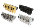 Four metallic guitar bridges in gold, black, silver, and chrome colors displayed on white background.