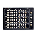 Top view of a Vermona PerFourMer MKII quad analog synthesizer with multiple control knobs and input/output jacks.