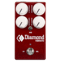 Red guitar effect pedal with four white knobs, a toggle switch, and a footswitch labeled Diamond Vibrato.
