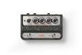Top view of a dark green Warm Audio guitar pedal with knobs, switches, and two footswitches labeled Effect and Vibrato.