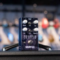 Black and blue guitar effects pedal with knobs, switches, and footswitch labeled Cryptid by Wampler.