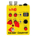 Yellow guitar effects pedal with red and black controls and labeling reading Geiger Counter by WMD.