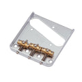Silver metal guitar bridge plate with three gold-colored adjustable saddles and four mounting holes.