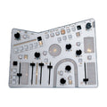Top view of a silver electronic synthesizer with knobs, sliders, and buttons labeled with various sound parameters.
