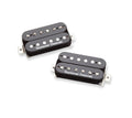 Two black Seymour Duncan humbucker guitar pickups with adjustment screws visible
