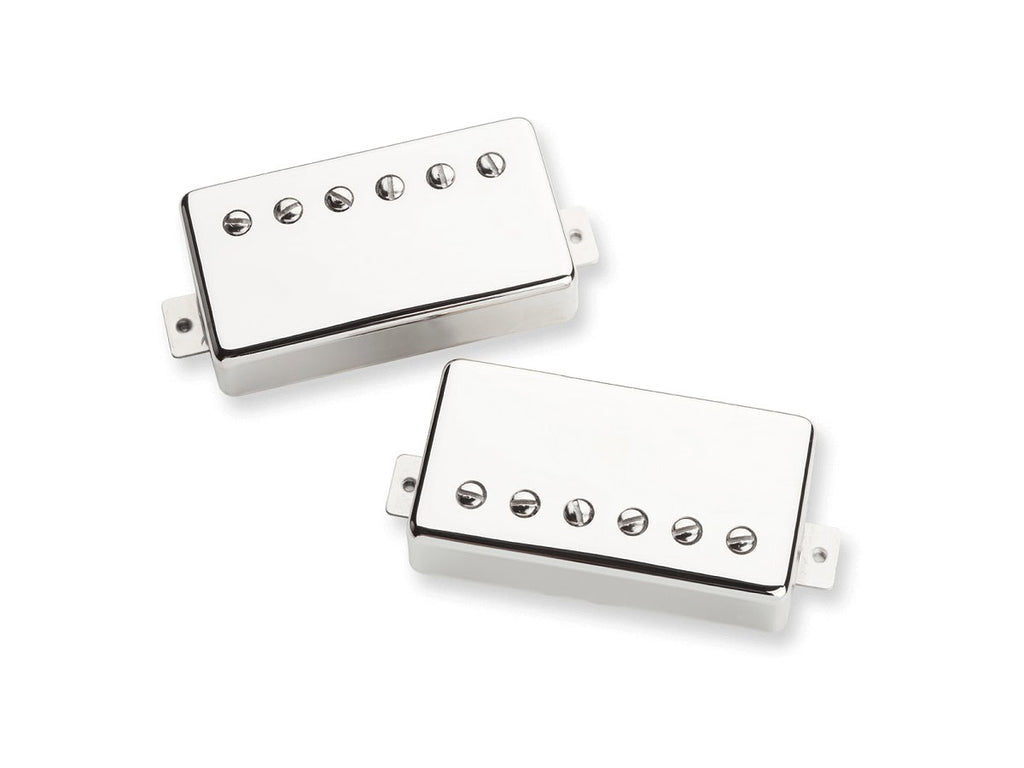 Two nickel-covered humbucker guitar pickups with six adjustable pole screws each on a white background.