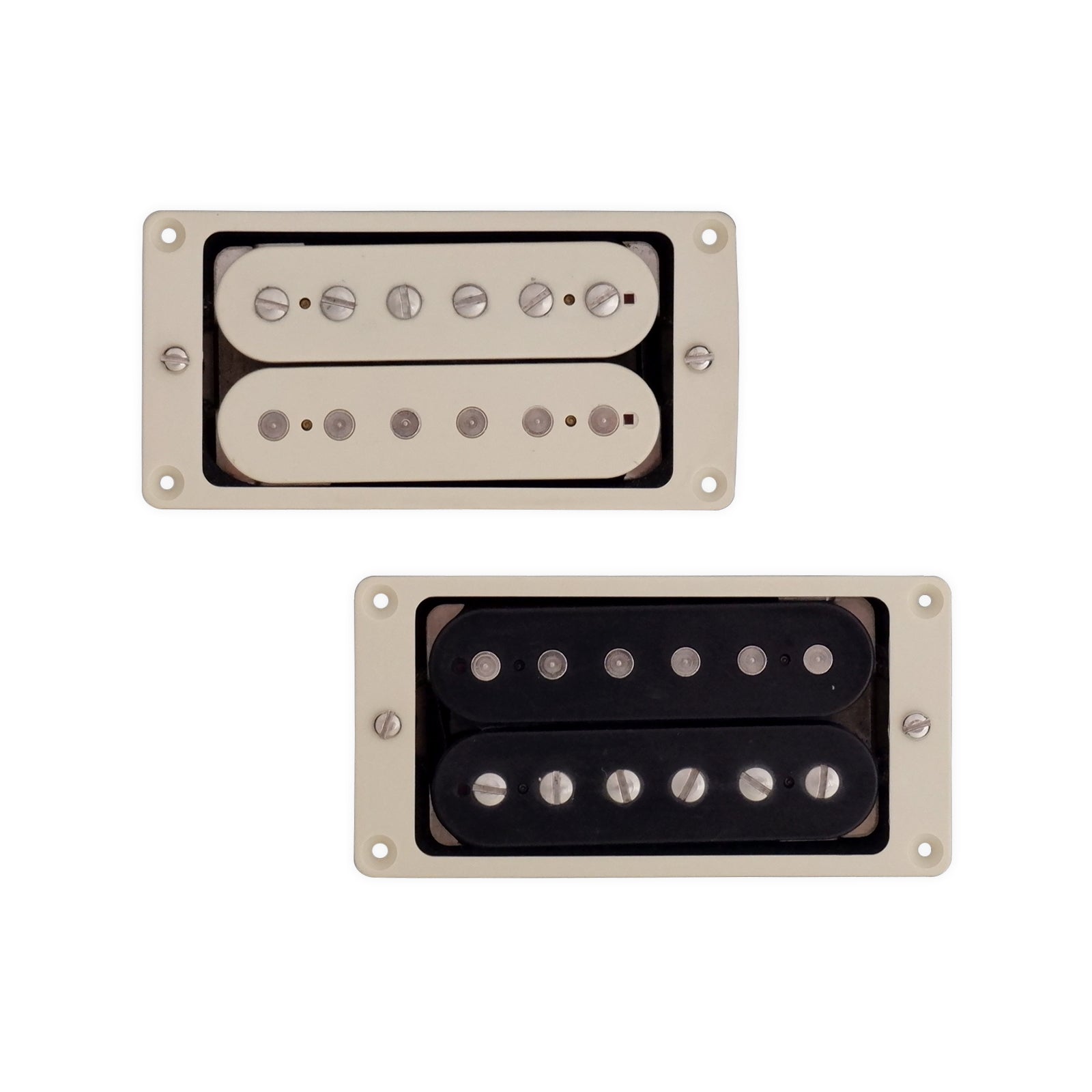 Two humbucker pickups with cream mounting rings, one with cream covers and one with black covers.