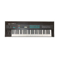 Black Yamaha DX9 synthesizer keyboard with sliders, buttons, and keys.