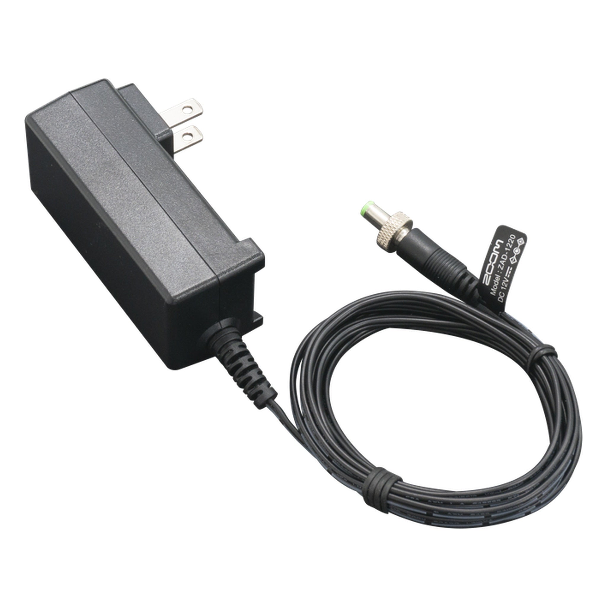 Black rectangular AC power adapter with coiled cable and green-tipped barrel DC plug.