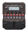 Top view of a ZOOM multi-effects processor pedal with knobs, buttons, an LCD screen, and two foot pedals.