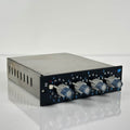 A black API 550b 500 Series equalizer module shown vertically, with four large round aluminum rotary knobs stacked down the center, concentric frequency and boost/cut markings around each knob, API branding and the "550b" label at the top, and an IN switch at the bottom.