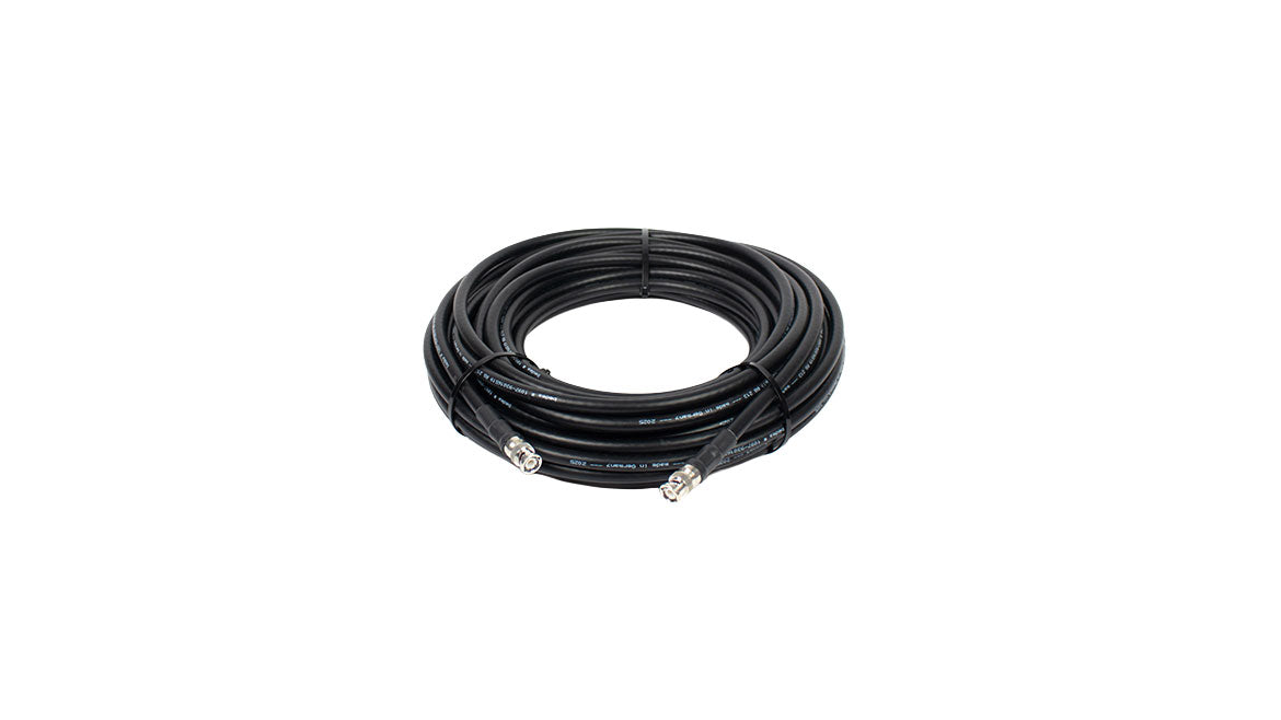 Coiled black coaxial cable with silver BNC connectors on both ends.