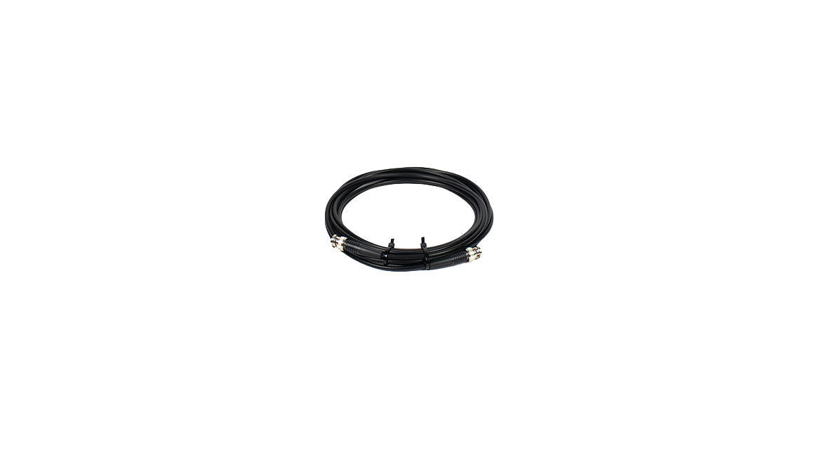 Coiled black cable with metallic circular connectors on both ends secured by two black ties