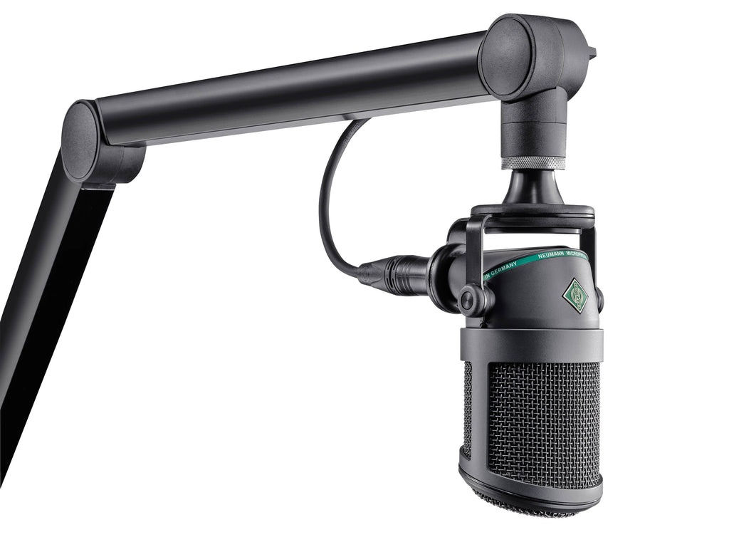 Black studio microphone mounted on an adjustable arm with visible metal mesh and XLR connector.