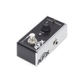 Small black and silver guitar pedal with one knob, toggle switch, footswitch, and single 1/4 inch input jack.