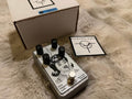 A compact boutique guitar and bass effects pedal labeled Gnarled by Dirty Haggard Audio, with top-mounted control knobs, a footswitch, and 1/4-inch input and output jacks on a metal enclosure.