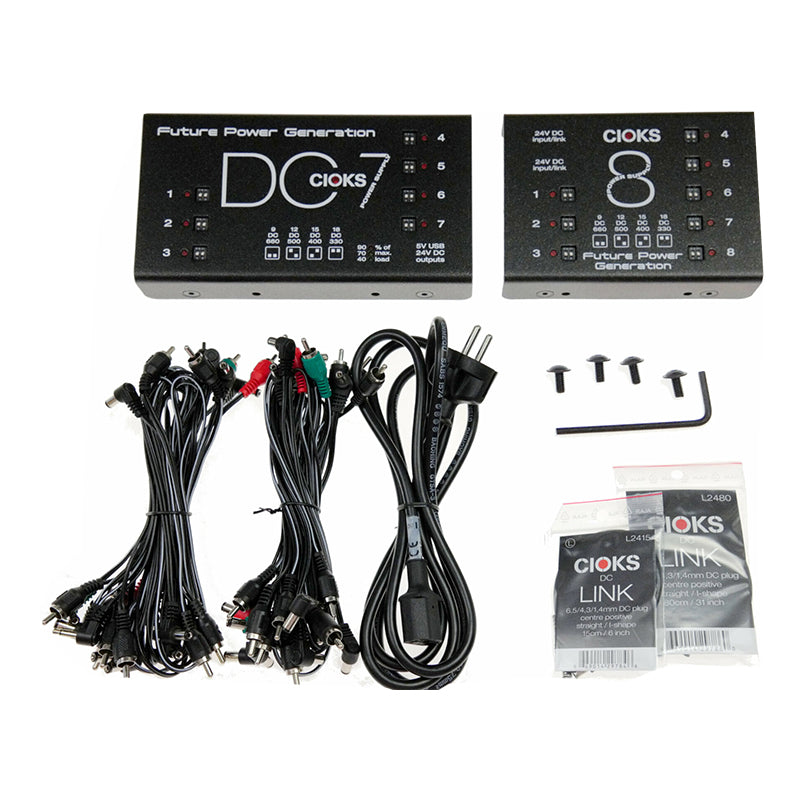 Two black Cioks DC power supply units with multiple cables, connectors, screws, an allen wrench, and adapter packs.