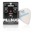 Black guitar compressor pedal with three control knobs and a white guitar pick beside it