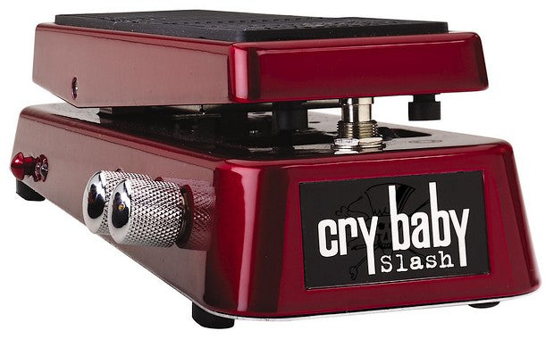 Red guitar effects wah pedal with black tread and two silver knobs on the side labeled cry baby slash.