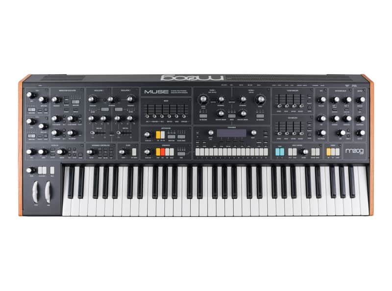 A Moog Muse 61-key analog synthesizer viewed from above, with wooden end cheeks and a dark control panel covered in rows of knobs, sliders, and small displays above the full-size keyboard.