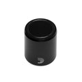 Black cylindrical knob with a stylized white D logo on its side