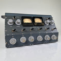 Vintage grey-blue painted steel stereo preamplifier mixer console shown at a three-quarter angle, with two analog VU meters, a top-panel "STEREO PREAMPLIFIER MIXER" legend, a row of small A/B toggle switches, and six large front rotary level knobs labeled MIC 1 through MIC 5 and PHONO.