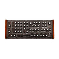 Front view of a black synthesizer with wooden side panels and multiple labeled knobs and buttons.