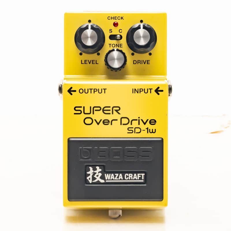 A bright yellow Boss SD-1W Super Overdrive compact guitar pedal, showing three top-mounted knobs (Level, Tone, Drive), a small mode switch, a CHECK indicator LED, and a large footswitch pedal.